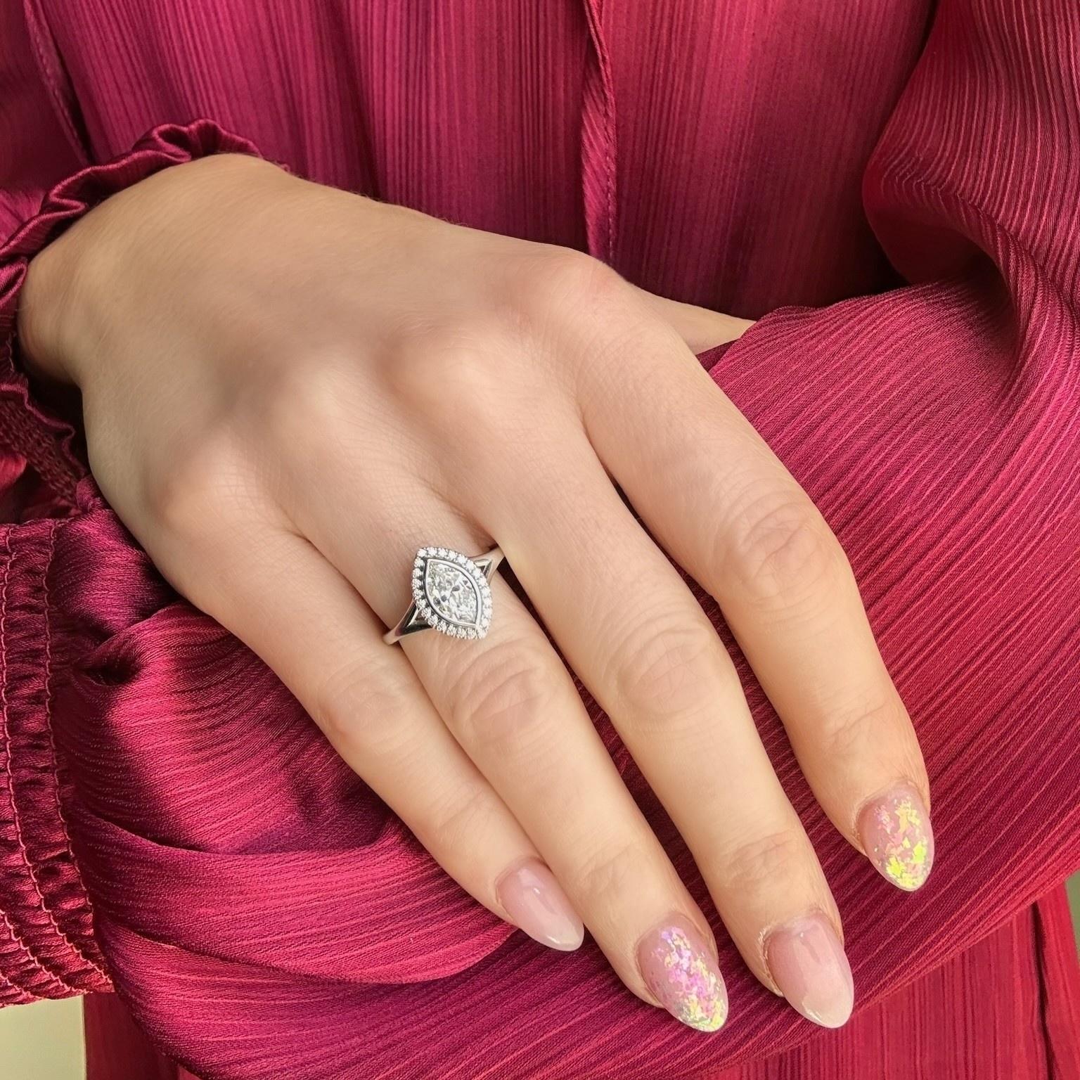 close up of Gabriella 18K White Gold Bezel Set Marquise & Diamond Halo Ring